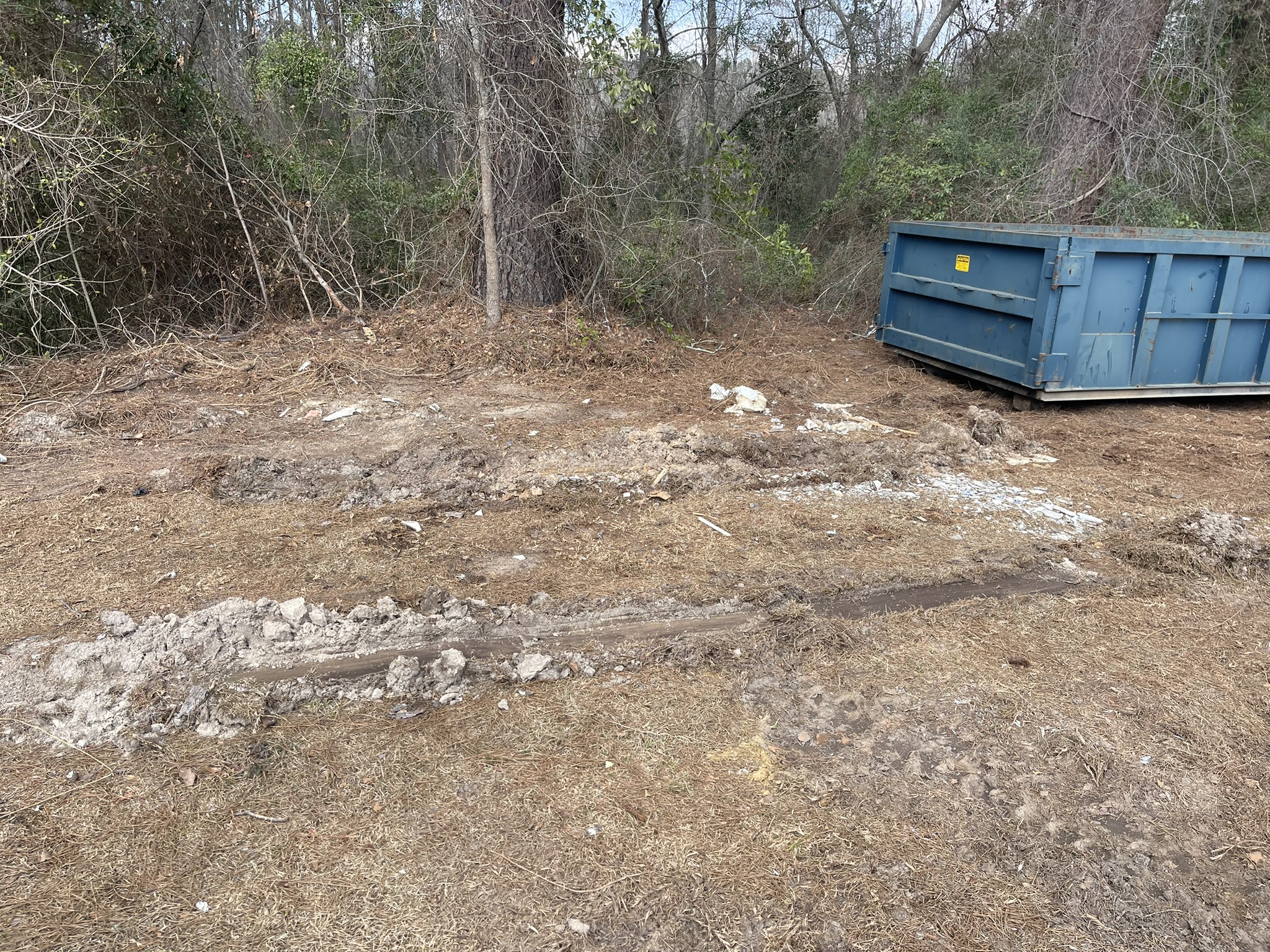 Lawn damage from a traditional roll-off container delivery truck